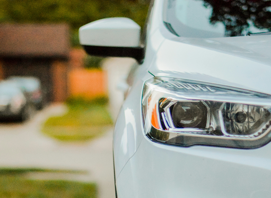 Close-up of a modern car headlight with sleek, stylish design