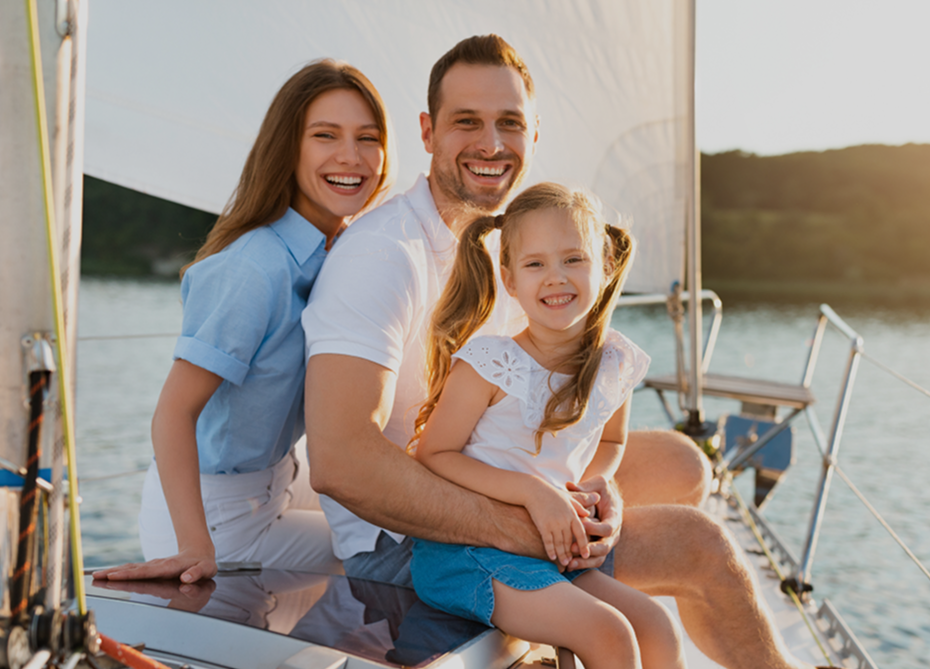 Happy family enjoying a boat ride together on a sunny day
