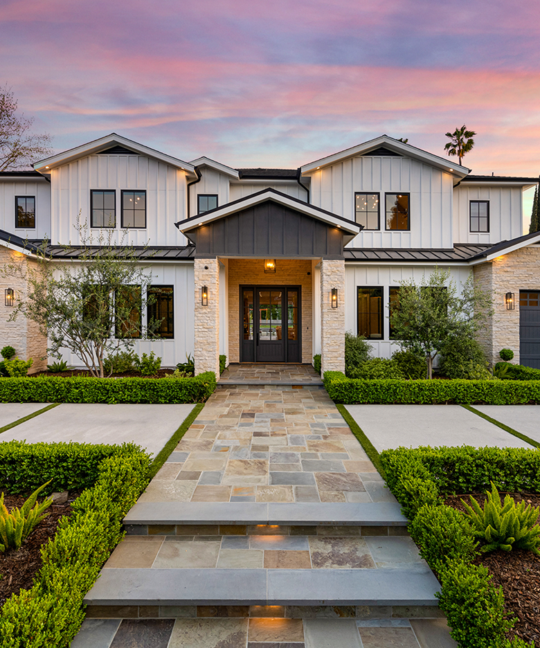 High-end home exterior featuring elegant stone steps and upscale design